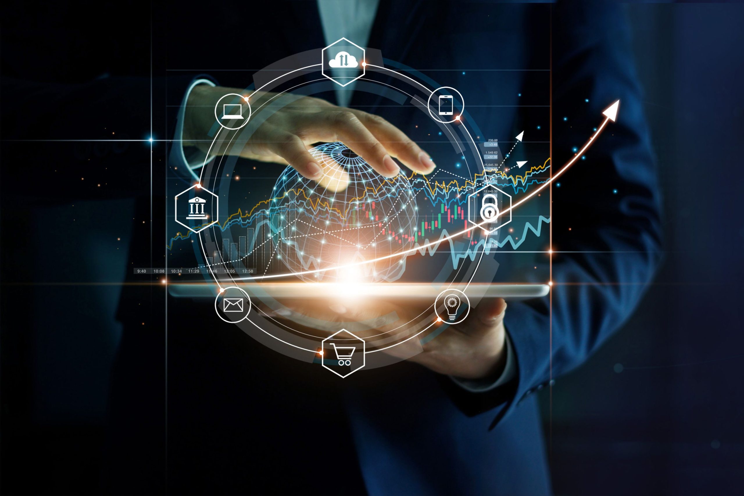 Nad tabletem unoszą się cyfrowe wykresy