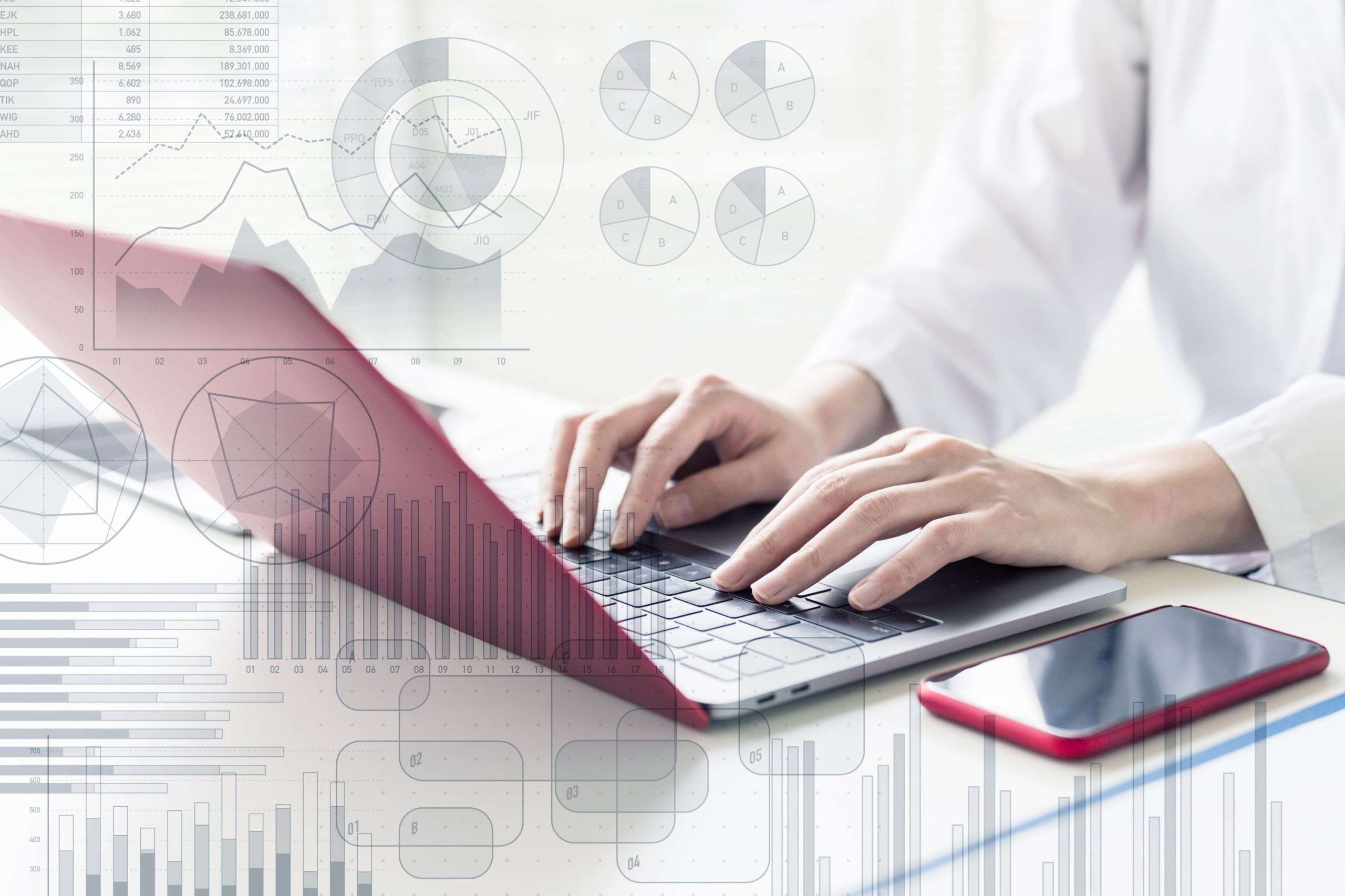 Laptop i wykresy w tle